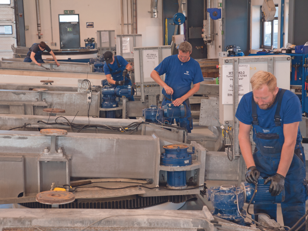 WindTech employees working on nacelle frames